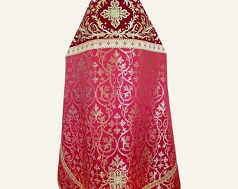 May include: A liturgical vestment featuring a deep red velvet upper section with gold embroidered cross motifs and a lower section in a lighter red fabric with an intricate gold damask pattern of scrolling vines and crosses.