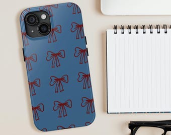 Funda resistente para teléfono con lazo rojo y soporte para iPhone, fondo azul con lazos repetidos