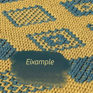 May include: A close-up of a crocheted fabric with a blue and yellow diamond pattern. The fabric has a tear in it, revealing a dark background with the word "Example" written in yellow.