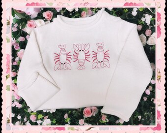 Beautiful roll=neck sweater for your little!  Ivory sweater with crawfish trio; Louisiana inspired!