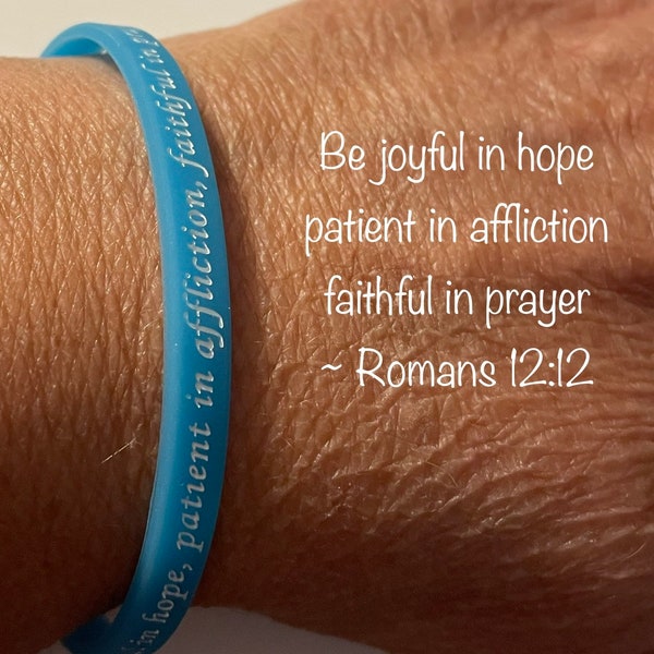 Romans 12 glow-in-the-dark wristbands read - Be joyful in hope, patient in affliction, faithful in prayer  ~ Romans 12:12