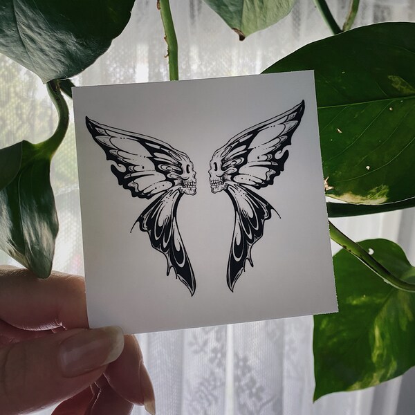 two-faced butterfly and skull sticker