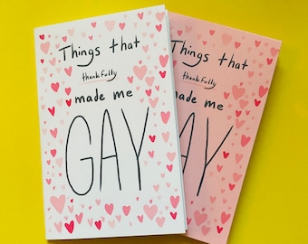 May include: Two small pink and white notebooks with the text "Things that thankfully made me GAY" on the front. The notebooks are covered in pink hearts.