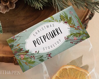 May include: A clear plastic bag filled with dried orange slices, cinnamon sticks, and bay leaves. The bag has a label that says "Christmas Stovetop Potpourri".