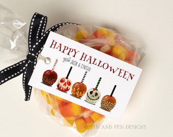 May include: A clear cellophane bag filled with candy corn and a tag that reads "Happy Halloween." The tag features illustrations of caramel apples with various designs. The bag is tied with a black and white ribbon.