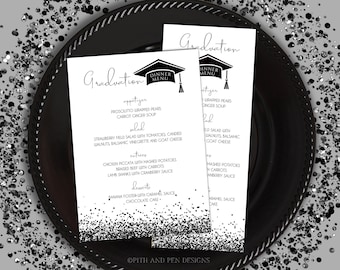 May include: Black and white graduation dinner menu with a graduation cap icon. The menu lists appetizers, salad, entrees, desserts, and the text "Graduation Dinner Menu".