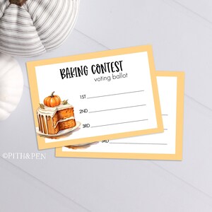 May include: Two yellow voting slips for a baking competition. The slips feature a watercolour illustration of a pumpkin spice cake with a pumpkin on top. The text "Baking Contest" and "voting ballot" are printed on the slips.