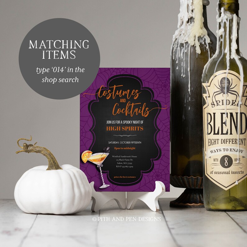 May include: A Halloween-themed invitation with the text "Costumes and Cocktails" in orange script on a black background, supported by a white easel. A white pumpkin and two antique bottles are also in the image.