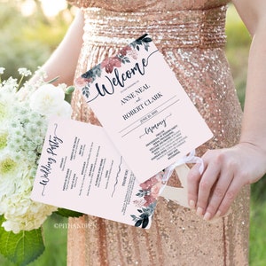 Puede incluir: Un abanico de programa de boda rosa y blanco con un diseño floral. El programa incluye la fiesta de bodas, el orden de la ceremonia y un mensaje de agradecimiento. El texto en el abanico dice "Bienvenido a la boda de Anne Neal y Robert Clark, 25 de junio de 2021".