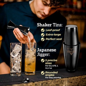 May include: A black cocktail shaker with a gold logo that says "Prodigy Mix". The shaker is next to a black and silver Japanese jigger with five measurements: 0.5, 0.75, 1, 1.5, and 2 ounces. The jigger has rounded angles for easy pouring.