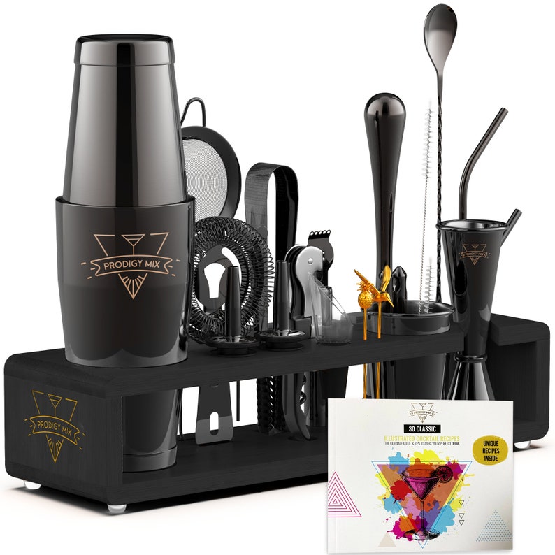 May include: Black cocktail shaker set with a wooden stand and a recipe book. The set includes a cocktail shaker, jigger, muddler, strainer, bar spoon, and other tools. The recipe book has colorful illustrations and the text "3D Classic Illustrated Cocktail Recipes".