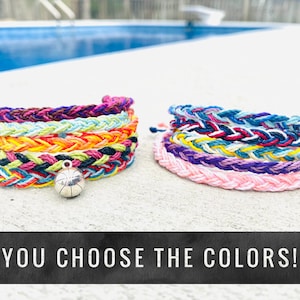 May include: Two stacks of colorful friendship bracelets with a silver basketball charm.  You choose the colors!