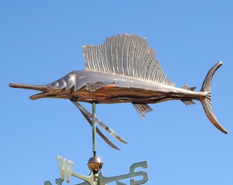May include: A copper sailboat weather vane with a sailfish design. The weather vane has a compass rose with the letters N, S, E, and W.
