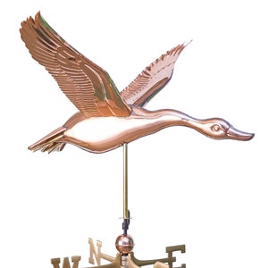 May include: A copper goose weathervane with a compass rose and the letters N, S, E, and W. The goose is in flight with its wings spread.