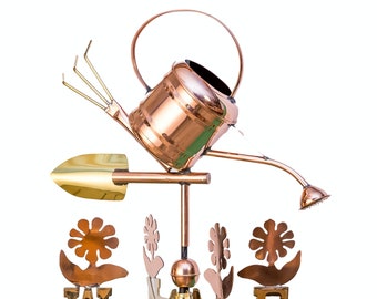 May include: Copper garden weathervane with a watering can, shovel, rake, and flowers. The weathervane has a compass with the directions North, South, East, and West.