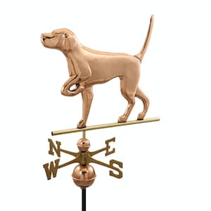 May include: A copper-colored weather vane featuring a dog pointing with its right paw. The vane is mounted on a black pole with a compass rose and the letters N, S, E, and W.
