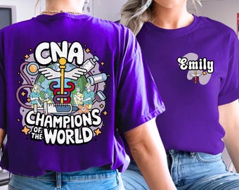 May include: Two purple t-shirts, one with the text "CNA Champions of the World" and a graphic of a caduceus and nurses, and the other with the text "Emily".