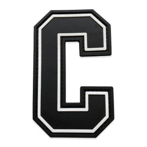 May include: Black felt letter C with a white outline. The letter is in a varsity style font.