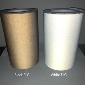 May include: Two rolls of reflective tape, one black and one white. The rolls are labeled "Black ELG" and "White ELG".