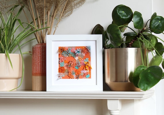 Framed medium orange embroidered coral artwork