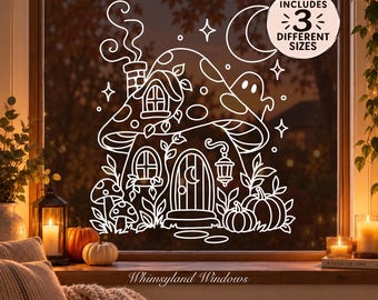 May include: A white line art window decal featuring a mushroom house with a chimney, a crescent moon, stars, a ghost, and pumpkins. A circular badge in the upper right corner contains the text INCLUDES 3 DIFFERENT SIZES in black lettering.