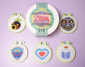 Zelda Mystery Cross Stitch Cup, Mystery Blind Box with DIY Mini Cross Stitch Kit, Moon, Zelda Hylian shield, heart, lon lon milk, deku mask.