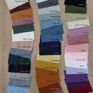 May include: A collection of fabric swatches in various colors, including blue, green, pink, and brown. Each swatch is labeled with its color name, such as "Cloudy Sky," "Teal," and "Mustard Yellow." The swatches are arranged on a neutral-toned background.