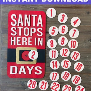 May include: A red wooden sign with the text "SANTA STOPS HERE IN DAYS" and a black belt with a gold buckle. There are 24 white circles with red numbers 1 through 24, representing the days until Christmas.
