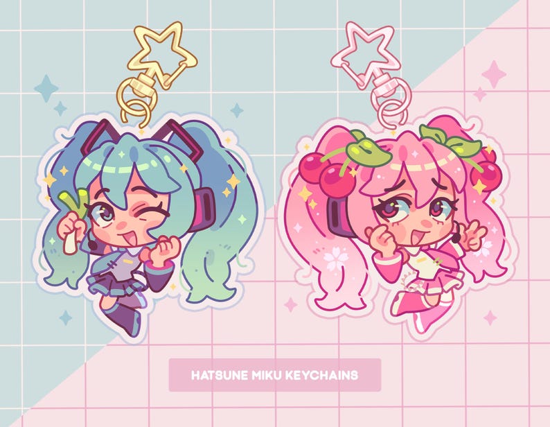 May include: Two colorful anime character keychains with gold star charms. The keychain on the left features a green-haired character holding a green vegetable. The keychain on the right features a pink-haired character with a cherry headband. The text "Hatsune Miku Keychains" is at the bottom of the image.