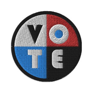 May include: A round, black-bordered patch with the word "VOTE" spelled out in white, blue, and red letters. The letters are arranged in a circle, with each letter in a different colour.