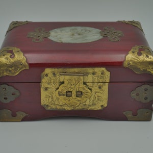 Vintage Chinese wood jewelry box, with brass accents, carved jade lotus medallion