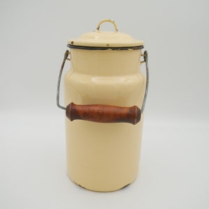 Vintage enamel milk pail with wood handle, beige enamelware milk can