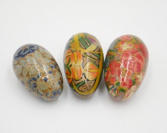 Wooden eggs in red blue and green hand decorated