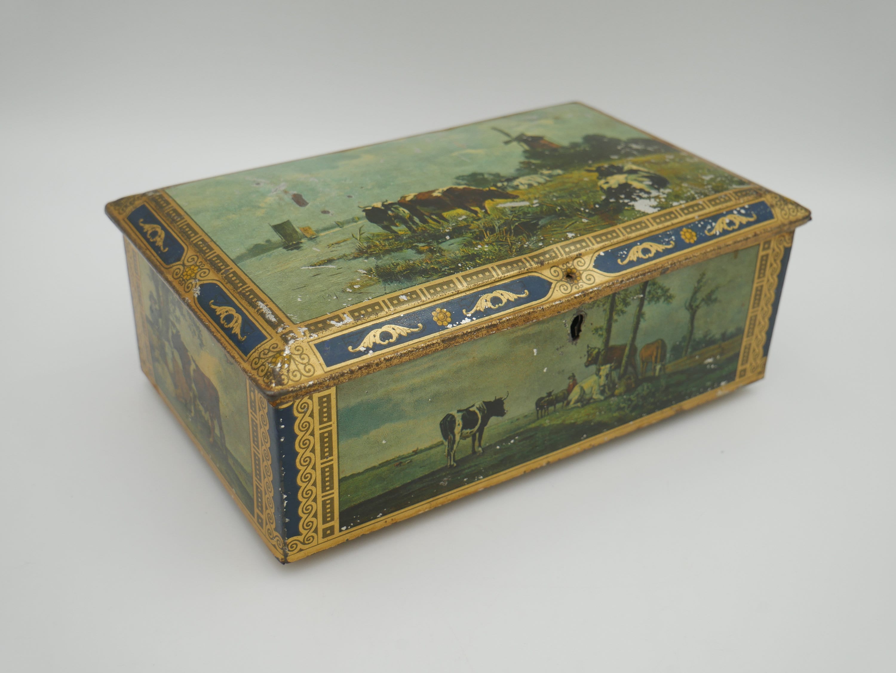 Vintage British biscuit tin, rectangular with pastoral scene, cows, sheep and goats
