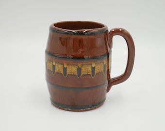 Troyan folk art barrel shaped mug, brown and yellow drip glaze