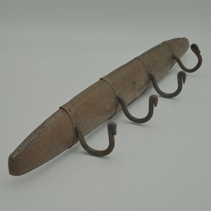 Vintage wood and metal coat rack, metal plated with four iron hooks, primitive wall rack