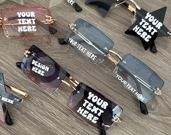 May include: Assortment of stylish sunglasses with various frame shapes, including star and rectangular designs. The lenses are tinted in shades of blue, pink, and black. Each pair features the text "YOUR TEXT HERE" or "DESIGN HERE".