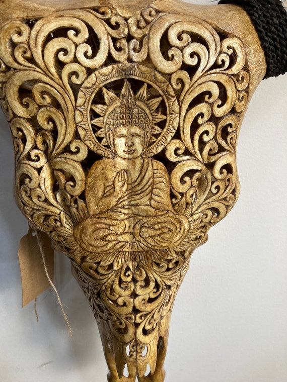 Intricately Carved Buffalo Skulls with Buddha Intricately Carved Buffalo Skulls with Buddha