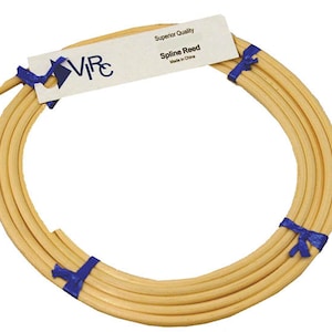 May include: A roll of natural colored spline reed, tied with blue ribbon. The label reads "Superior Quality Spline Reed Made in China".