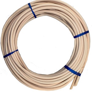 May include: A roll of natural-colored, round, wooden wicker weaving material, tied with blue ribbon.