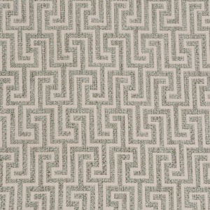 May include: A close-up of a fabric with a repeating geometric pattern of interlocking squares in a light green colour on a cream background.