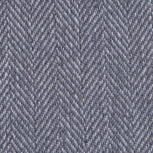 May include: A close-up of a blue and white herringbone fabric. The fabric has a subtle texture and a classic pattern.