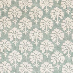 May include: A light blue fabric with a white floral pattern. The pattern is a repeating design of stylised carnations.