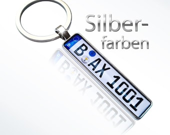Keyring, car license plate, license plate, vehicle trailer, car, passenger vehicle, gift, driver's license, new car