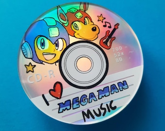 Może przedstawiać: Okrągła holograficzna płyta CD-R z kolorową ilustracją Mega Mana i Rusha. Płyta zawiera czerwone serce, czerwoną gitarę elektryczną, gwiazdki, nuty oraz tekst I LOVE MEGAMAN MUSIC, 700, 52x, 80 i CD-R.