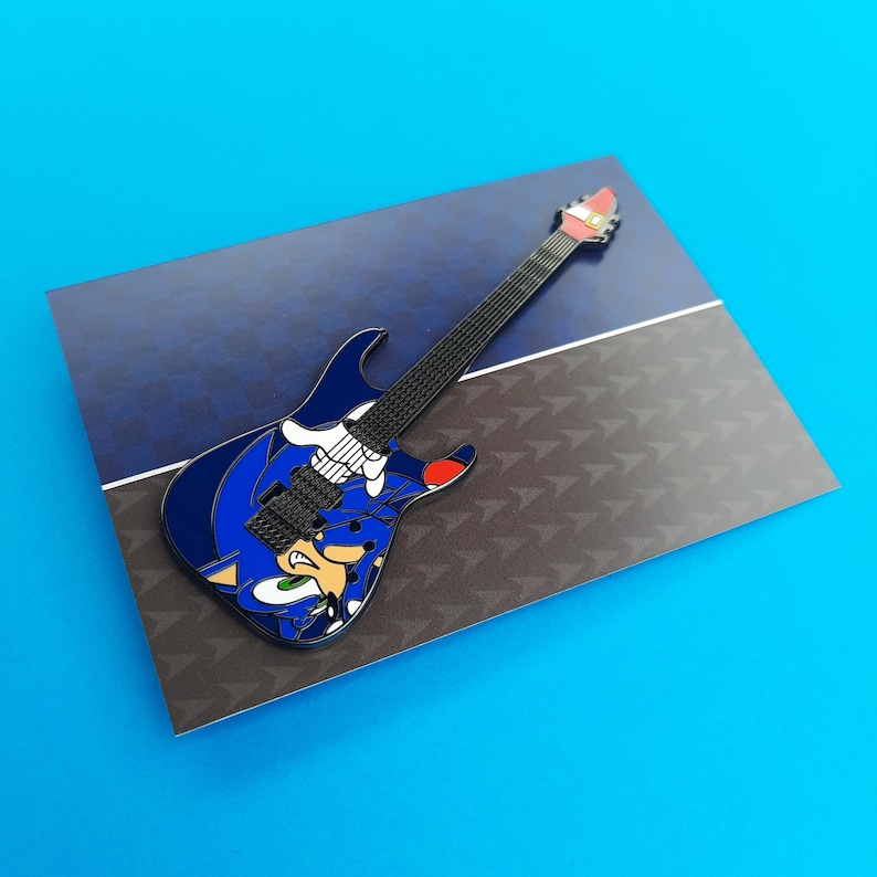 Enamel pin badge based on the ESP Sonic-II guitars, shown here on the backing card if you purchase just the Sonic variant.