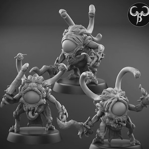 May include: Three detailed miniature monster figurines with large central eyes, multiple tentacles, and menacing expressions. Each figure is mounted on a round base. The figures are in a grayscale color palette.
