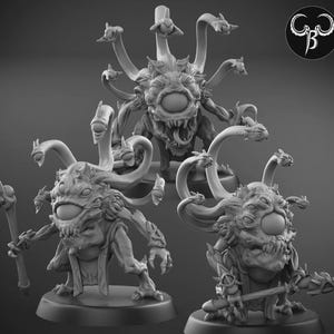 Peut inclure: Trois figurines de créatures fantastiques en niveaux de gris. Chacune a un grand œil central, de multiples petits yeux sur des tentacules et une expression menaçante. L'une tient un bâton, une autre une arme.