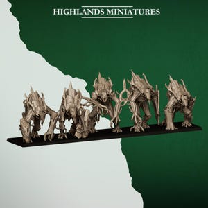 May include: Miniature fantasy figures of humanoid creatures with a wooden texture, arranged on a black base. The figures have a detailed, gnarled appearance, with limbs and bodies resembling tree branches. The text "HIGHLANDS MINIATURES" is at the top.
