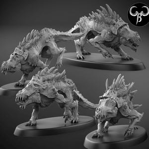 May include: Four grey, detailed, miniature, plastic, fantasy creatures with spiky backs and sharp teeth. The creatures are posed on circular bases.